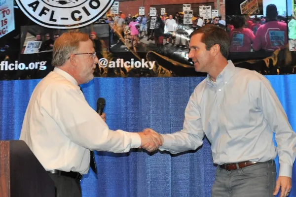 Londrigan and Beshear at the 2019 state AFL-CIO convention     Photo by BERRY CRAIG
