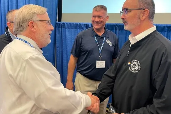 From left, Kentucky State AFL-CIO President Bill Londrigan, Mark Dowell, UAW Southeast CAP director; and Shawn Fain, UAW president.      Photo by BERRY CRAIG
