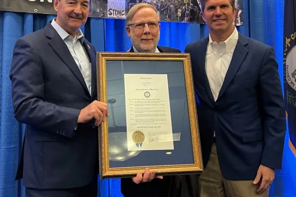 From left, Rocky Adkins, Bill Londrigan and Andy Beshear and the proclamation.      Photo by BERRY CRAIG