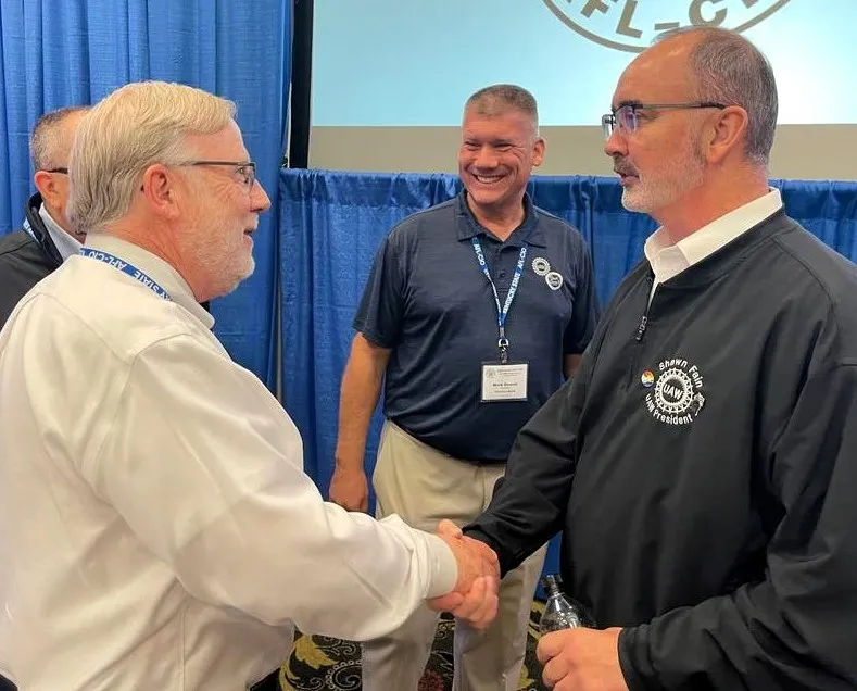 From left, Kentucky State AFL-CIO President Bill Londrigan, Mark Dowell, UAW Southeast CAP director; and Shawn Fain, UAW president.      Photo by BERRY CRAIG