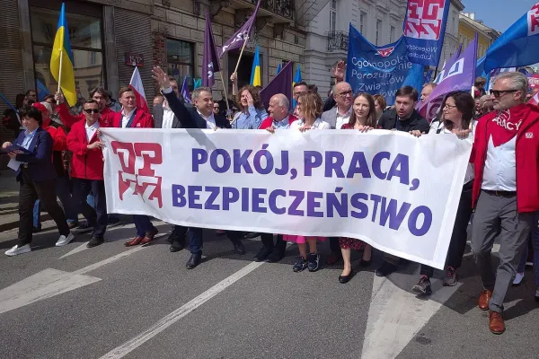 International Workers’ Day in Poland. The banner says “peace, work, security.” (Photo by Tomasz Molina [CC BY-SA 4.0] via Wikimedia Commons)