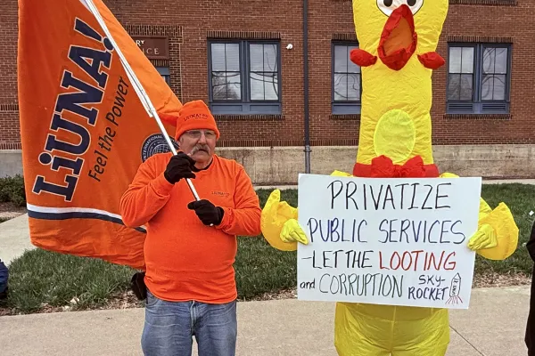 Chuck Paisley LiUNA 1214 and Jerry Sykes in chicken suit.     Photo by BERRY CRAIG